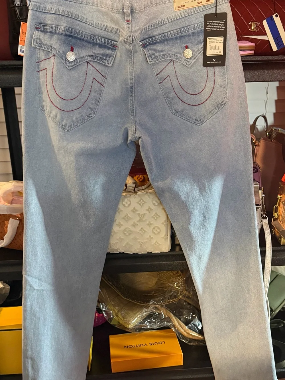 True Religion Light Blue Denim Jeans with Red Stitching. Relaxed Slim